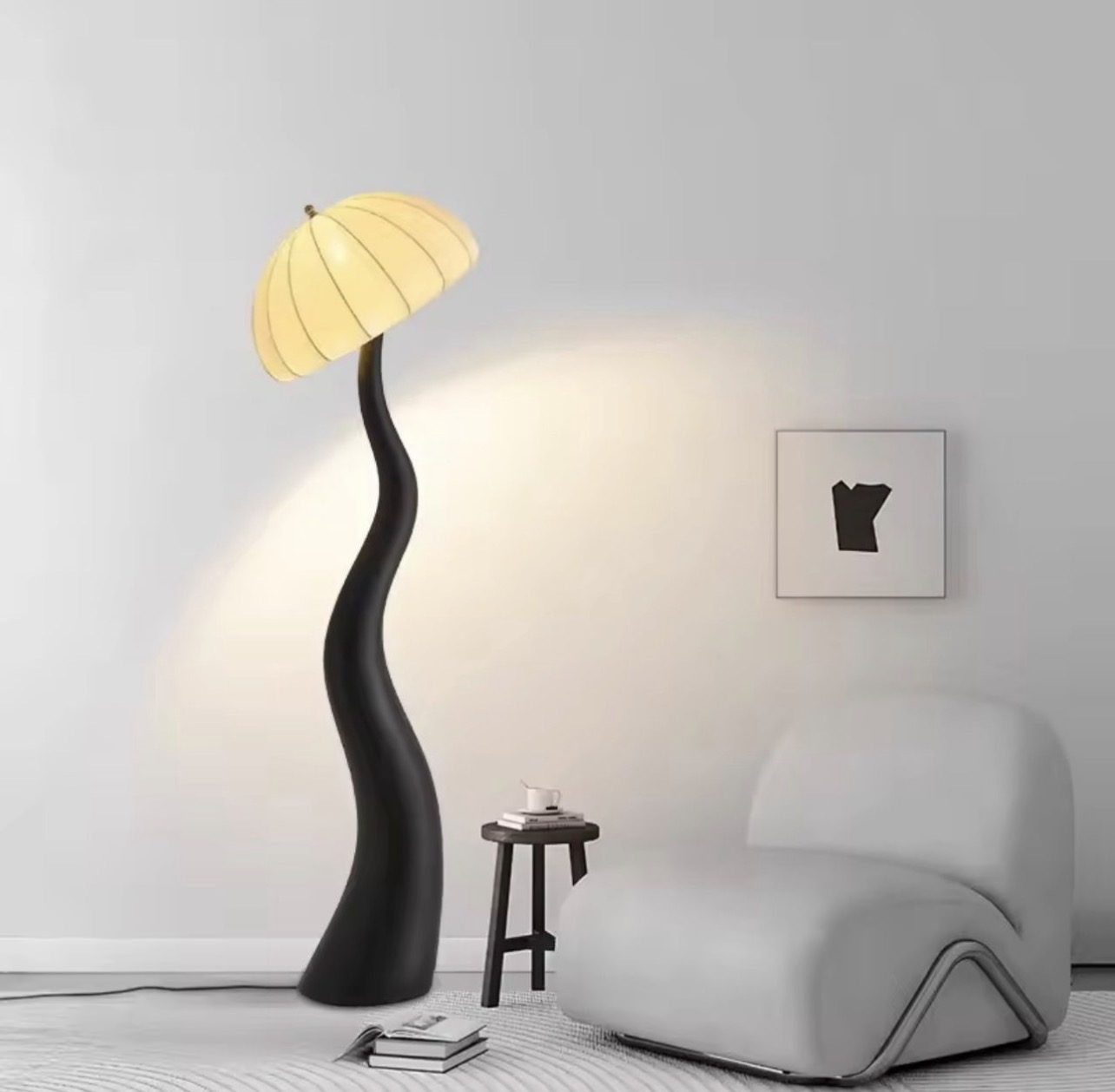 Curved sculptural floor lamp with an exposed bent frame