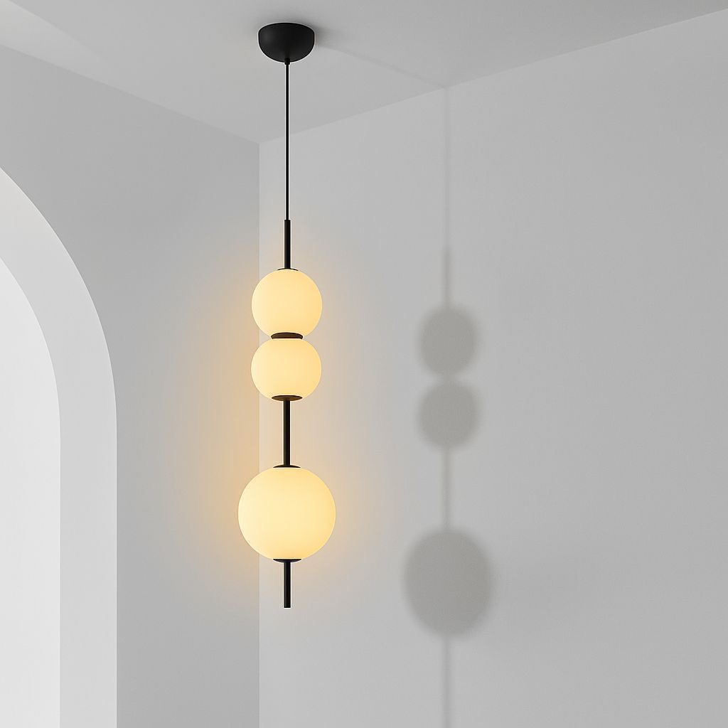 Pendant light with three globes stacked vertically