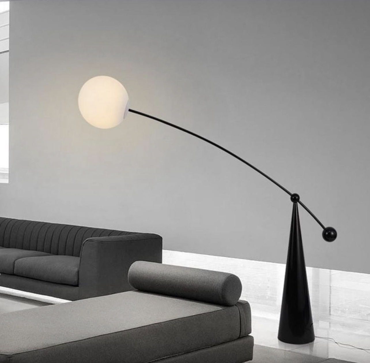 Arc floor lamp with a round globe-shaped shade