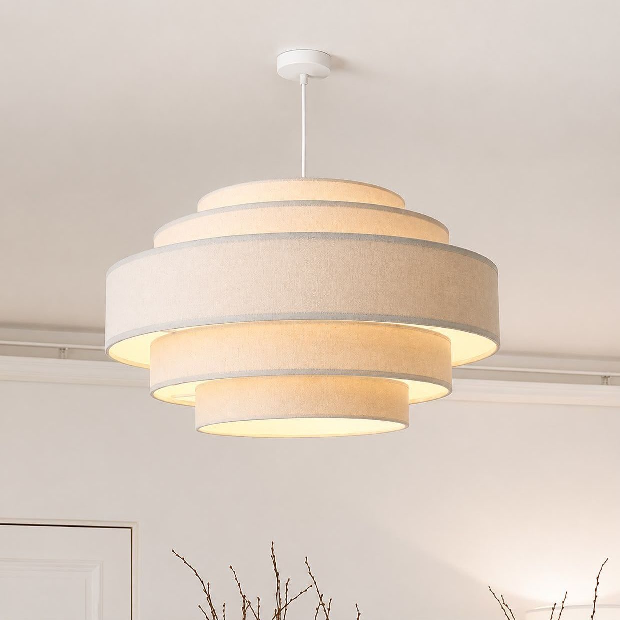 Pendant light with a tiered fabric drum shade
