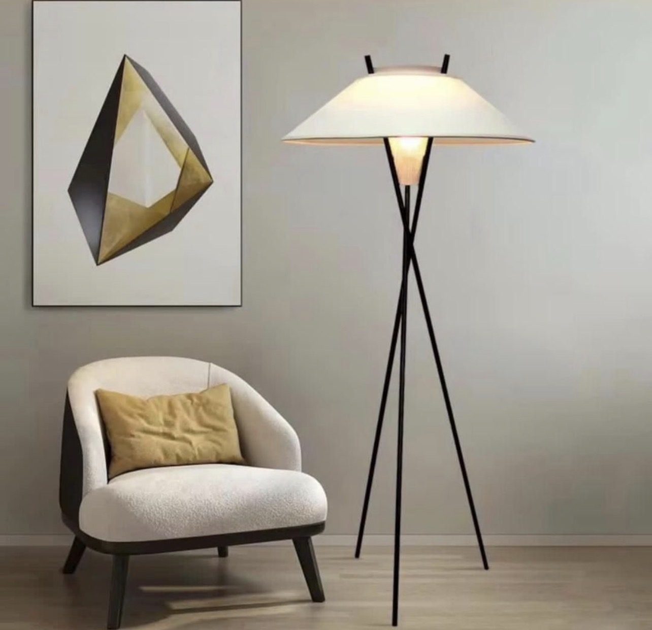 Tripod floor lamp with a wide saucer-shaped shade