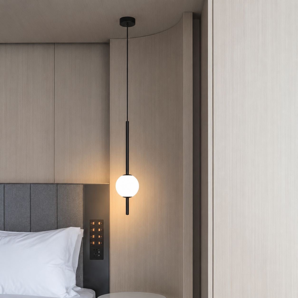 Single globe pendant light on a rigid rod